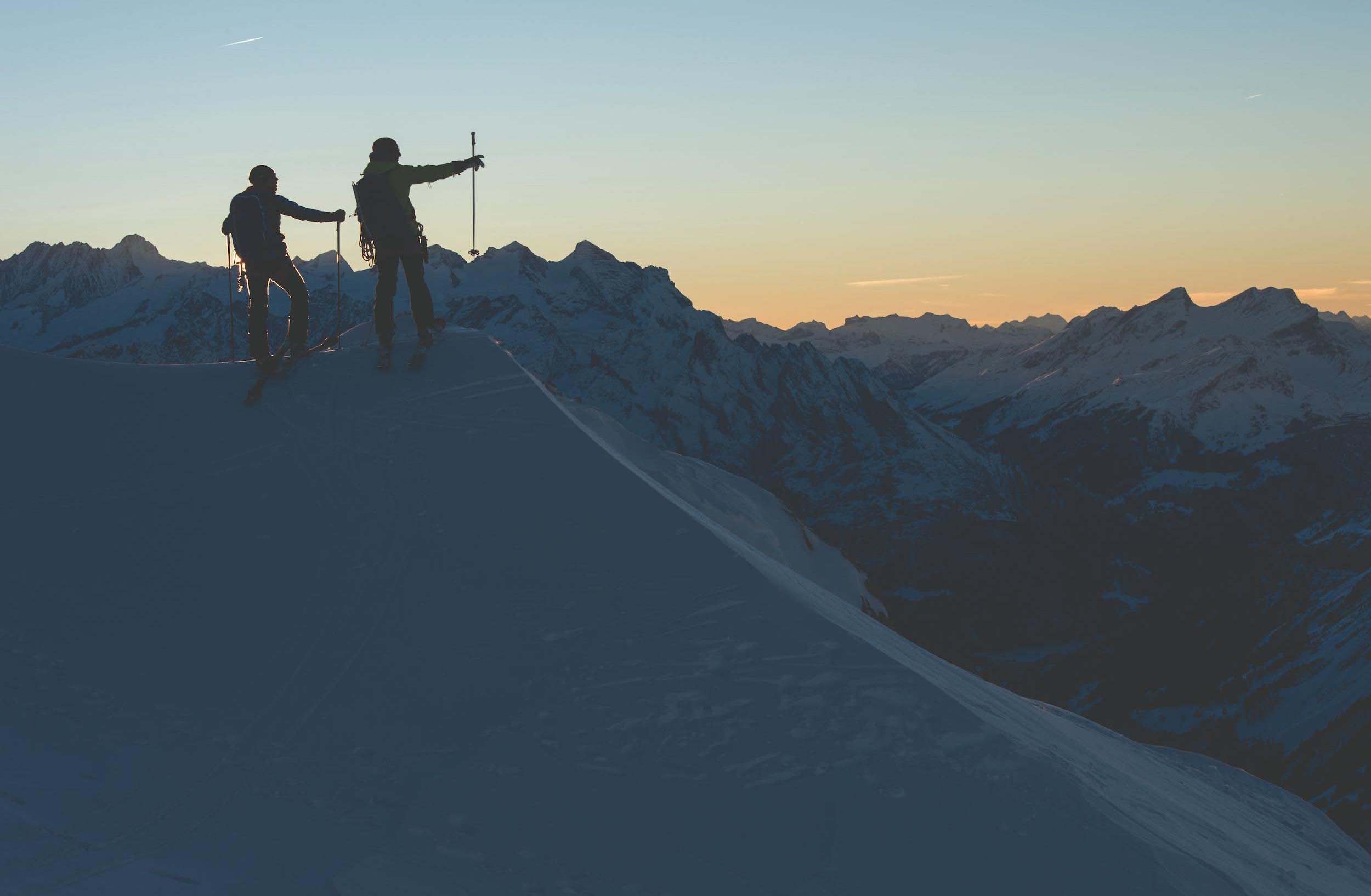 Dani Arnold on the summit in the morning dawn